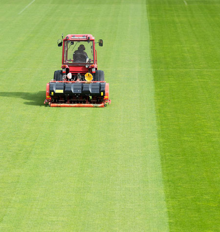 Man Mowing Sport Field